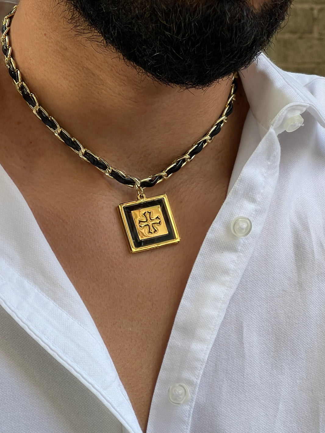 Stainless steel necklace intertwined with synthetic leather