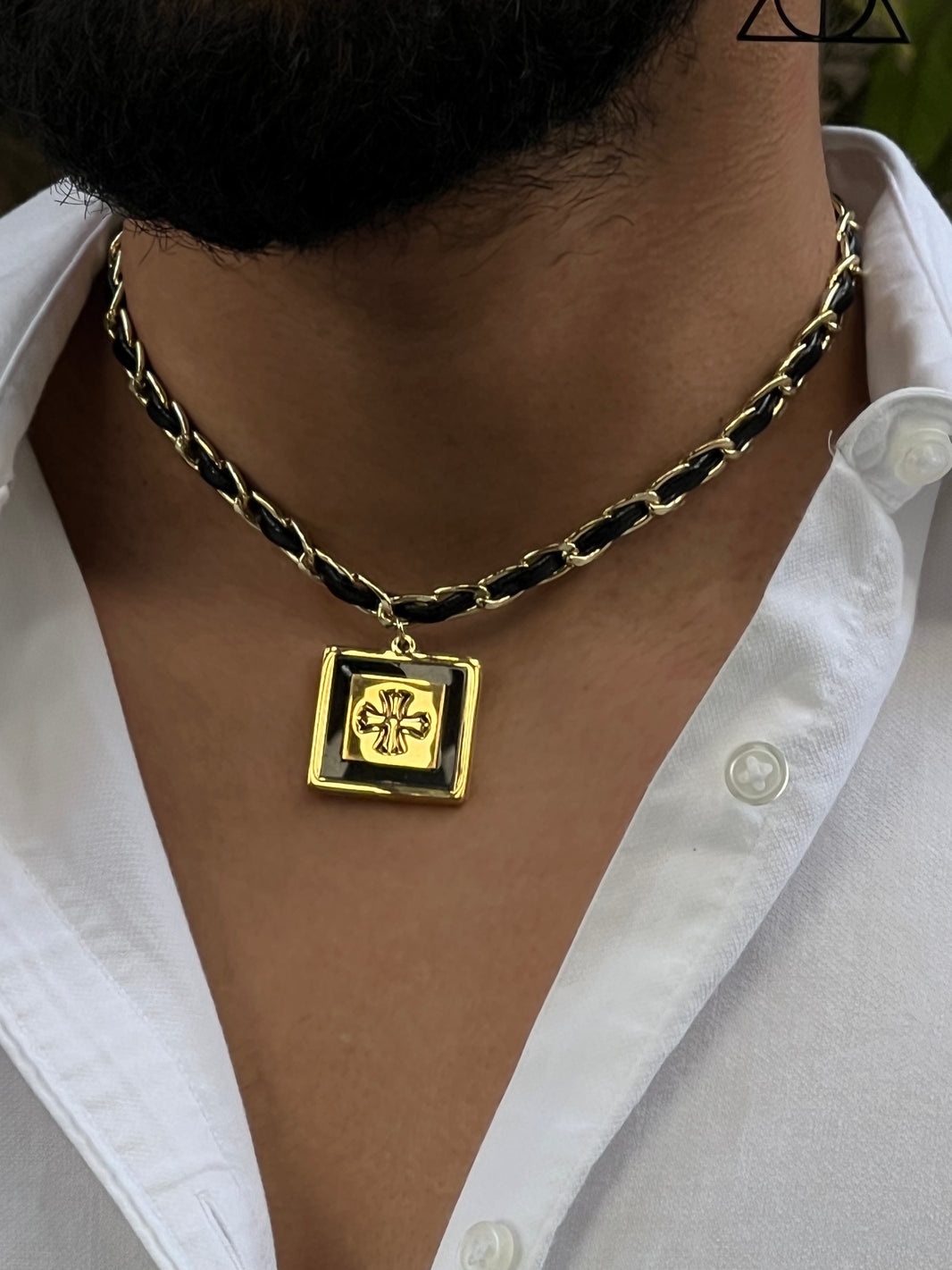 Stainless steel necklace intertwined with synthetic leather